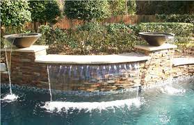 A smart feature is the tanning ledge. Pool Water Features Custom Waterfalls Fountains For Swimming Pools North Houston Backyard Oasis