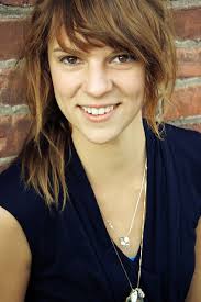 behind the restaurant, around the dumpsters