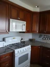 cherry cabinets white appliances have