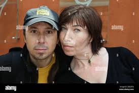 French actress Elise Larnicol and actor Pascal Vincent from 'Les Robin des  bois' arrive in the 'Village', the VIP area of the French Open at Roland  Garros arena in Paris, France on