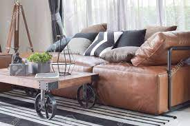 Arhaus furniture has a great assortment of living room sofas for all design styles. Wood Center Table With Wheel And Light Brown Leather Sofa In Stock Photo Picture And Royalty Free Image Image 82227687