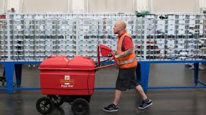 royal mail profits more than halve bbc news