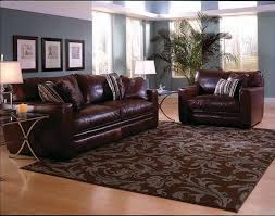 Living Room Rugs Ideas With Dark Brown Sofa With Awesome Area Rugs Glasses Table And Natural Rugs In Living Room Brown Sofa Living Room Brown Living Room Decor