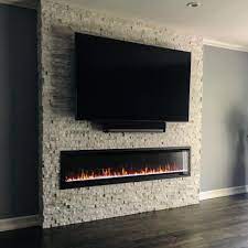 Using an electric fireplace alongside a tv can make for pleasant viewing and create a focal point for a room while it's not recommended to install a tv over an open wood burning fireplace, many choose to for wall mount electric fireplaces, the heater may be located either at the top or the bottom of. Electric Fireplace In 2021 Fireplace Tv Wall Living Room Decor Fireplace Fireplace