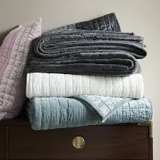 A trio of borders frames a dancing paisley print, delivering both sophistication and spirit. Velvet Quilt The Winter Bed Lonny