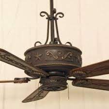 The intricate star and scroll work is simply amazing to behold and brings back the natural spirit of the old west. Cooper Canyon Western Star Ceiling Fan Rustic Lighting And Fans Rustic Ceiling Fan Ceiling Fan Western Home Decor