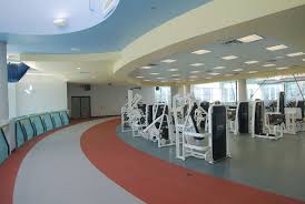 Physical Therapy Room With Machines And Circular Running Track Massage Therapy Rooms Physical Therapy Physiotherapy Clinic