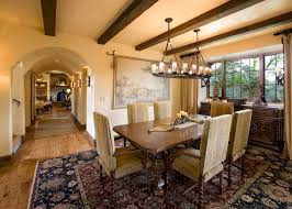 Gray and brown dining room featuring neutral decor and furnishings boasting a white oval sunburst mirror on a board and batten cream wall flanked by white lamp sconces. Dining Room Sconces Houzz