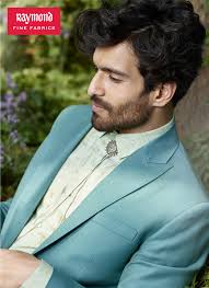 An endless sartorial narrative woven by Rajesh Pratap Singh for Raymond Fine  Fabrics. Presenting a unique selection of silhouettes and designs in shades  of blue ranging from turquoise to bright cobalt. Credits