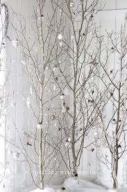 Use bare branches with lights and paper maple leaves cut using a large paper punch to make this easy diy fall decor. Bare Branch Trees Winter Home Decor White Christmas Tree Decorations Christmas Branches White Christmas Trees