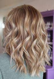 Warm Blonde Hair Shades Perfect For Brightening Your Locks This Spring Warm Blonde Hair Blonde Hair Shades Hair Color Caramel