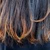 One option is to apply coconut oil, almond oil, or another type of moisturizer to the ends of your hair. 1