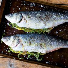 The fish striped bass and branzino are two fish. Whole Branzino Stuffed With Lemons And Herbs Balducci S