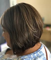 Rock that thick hair by scrunching in curls and building the body with mousse on a short hairstyle parted in the center. 34 Flattering Short Haircuts For Older Women In 2020