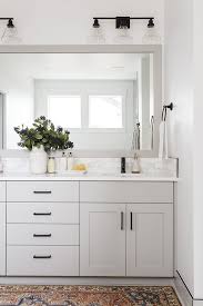 In this modern farmhouse kitchen, the designer's most favorite element is the wood paneled hood. New Construction Interior Design Ideas Modern Farmhouse Bathroom Bathroom Decor Bathroom Styling