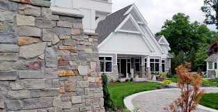 Wood, stone and brick, heavy trim, corbels, beams and tapered or squared entry columns are usually found on the exterior of the craftsman. Craftsman Style Home Stone Veneer Outdoor Living Space Buechel Stone Buechel Stone
