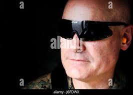 U.S. Marine Corps Sgt. Mason A. Howard, rifle line non commissioned  officer, ceremonial platoon, Headquarters and Service Battalion, brings the  rifle detail to present arms during the annual wreath laying ceremony for