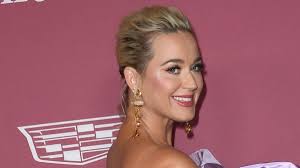 Katy Perry marks milestone moment in curve-hugging gown with a high slit