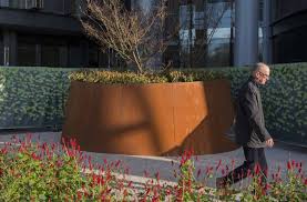 Starting out as a blue steel, as soon as corten steel is exposed to the elements it will naturally weather and develop a rich eye catching finish. Corten Steel Plant Pots Containers Corten Planters Iota Uk