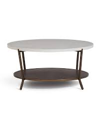 These tables make a strong industrial modern statement in your living space. Raul Quartz Metal Base Coffee Table