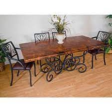 This large and long, antique dining room table was crafted in the french pyrenees. Wrought Iron Dining Tables Classic Elegant And Timeless Artisan Crafted Iron Furnishings And Decor Blog Wrought Iron Dining Table Dining Table Copper Wrought Iron Table