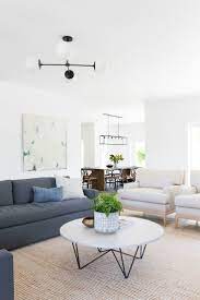 Modern Neutral Living Room Charcoal Sofa With White Linen Chairs Minimalist Styling Oversized B Living Room Furniture Layout Living Room Modern Living Decor