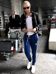 Cara Delevingne Dons Track Bottoms With A T Shirt And Jacket At Lax Cara Delevingne Style Adidas Track Pants Outfit Cara Delevingne