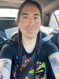 My hair is getting longer. First time braiding it…