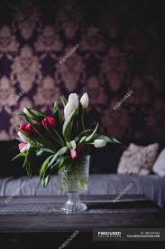 Flowers are one of the most beautiful creations of nature. Glass Vase With Tulips In Home Interior Bunch Plants Stock Photo 185181554