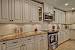 Antique White Kitchen Cabinets With Dark Island