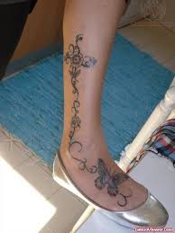 Foot tattoos butterflies and flowers. Flower And Butterfly Tattoo On Leg And Foot