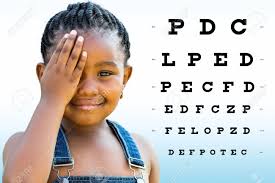 Close Up Portrait Of Little African Girl Testing Eyesight Girl