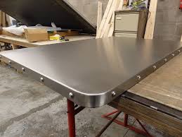 Stainless steel table for prep & work 24 x 60 inches, nsf commercial heavy duty table with undershelf and backsplash for restaurant, home and hotel. 31 Satin Stainless Steel Table Top With Chrome Studs Stainless Steel Table Stainless Steel Table Top Steel Dining Table