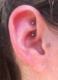 18g Rook Piercing I Did While At Iris Piercing In Denver Using An 18g Curved Barbell With Forward Facing Mint Green Gems Ear Piercings Rook Piercing Nose Ring
