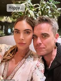 Ayda Field brands Robbie Williams 'Mr Romance' as he spends wedding  anniversary watching football