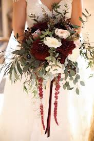 A Bright And Textural Winter Wedding Bouquet With Burgundy Blush And White Flowers And Lots Winter Wedding Bouquet Blush Bouquet Wedding Fall Wedding Bouquets