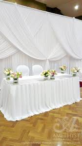 Pleated Chiffon Bridal Table Skirting With Gorgeous Wedding Backdrop Criss Crossed Drapings Diy Wedding Backdrop Wedding Backdrop Diy Wedding Decorations