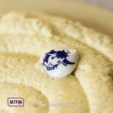 La Galette Est En Cours De Confection Au Cœur De Cette Appetissante Frangipane Une Belle Feve En Porcelaine Creee Par Artfun Pour L Ep Galette Des Rois Feves Et Galette