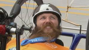 Man paralyzed in 2014 wins River Bank Run handcycle race