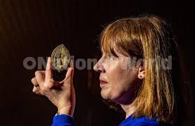 39438999-12 May 2022. . . . . . . . Dr Helen Rawson, Head of heritage and  participation officer with the seal matrix of the Vicars Choral of York  Mister dating from 1421. It shows the southern side