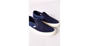 Complete with elastic cutouts for an easy on/off, a cushioned footbed, and finished with a textured rubber sole. Vans Classic Knit Suede Slip On Women S Sneaker In Navy Blue Lyst