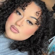 Who can provide hair and makeup services for a boudoir photography shoot in  Beachwood?