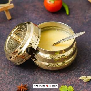 Authentic Bilona ghee is slow-cooked from cultured curd butter for a rich, nutty aroma, AI generated