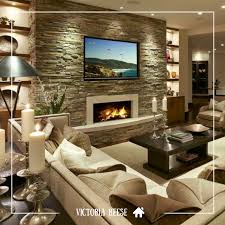 The Stone Accent Wall Creates A Strong Focal Point In This Living Room Space Whether You Re Modern Family Rooms Modern Family Room Design Elegant Living Room