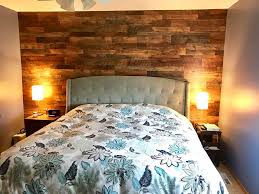 Wooden accents, like the textured wall, ceiling fan and rocking chair, bring a warmth to this white contemporary bedroom. Mn Diy Reclaimed Barn Wood Master Bedroom Accent Wall