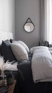 Simple Mirror Grey White Striped Bedding Paired With Darker Greys Whites Upholstered Light Headboard Home Decor Bedroom Bedroom Interior Home Bedroom