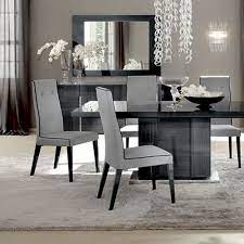 Accented by chrome additions, the dining table is available in two sizes and features a chrome base with detailing on the column, which also houses the extension leaf. Abitare Uk Alf Italia Montecarlo Palace Dining Chair