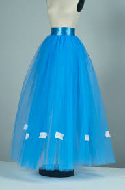 Using a small needle and a single thread, sew the hem with longer stitches. How To Cut And Hem A Tulle Skirt Threads