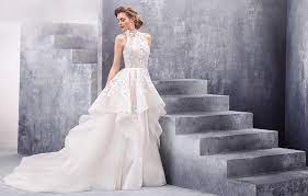Alluring contrasts are glimpsed in pairings like twinkle and matte, giving each dress an unmistakable charisma that enhances the bride's own captivating charm. Hayley Paige Lovely Bride