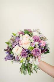 Purple and blue have the wonderful ability to be both restful and regal. A Romantic Spring Bridal Bouquet In Purple Pink Bridal Bouquet Spring Purple Wedding Flowers Purple Wedding Bouquets